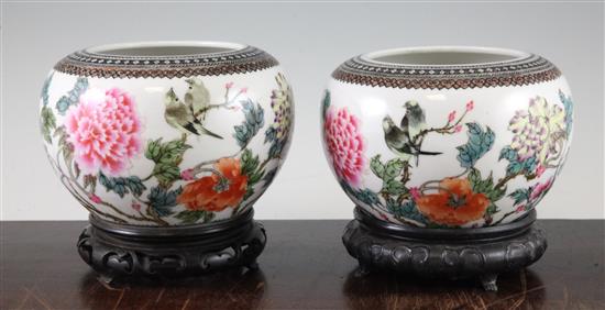 A pair of Chinese famille rose globular bowls, Qianlong marks, Republic period, 16.5cm diam, stands